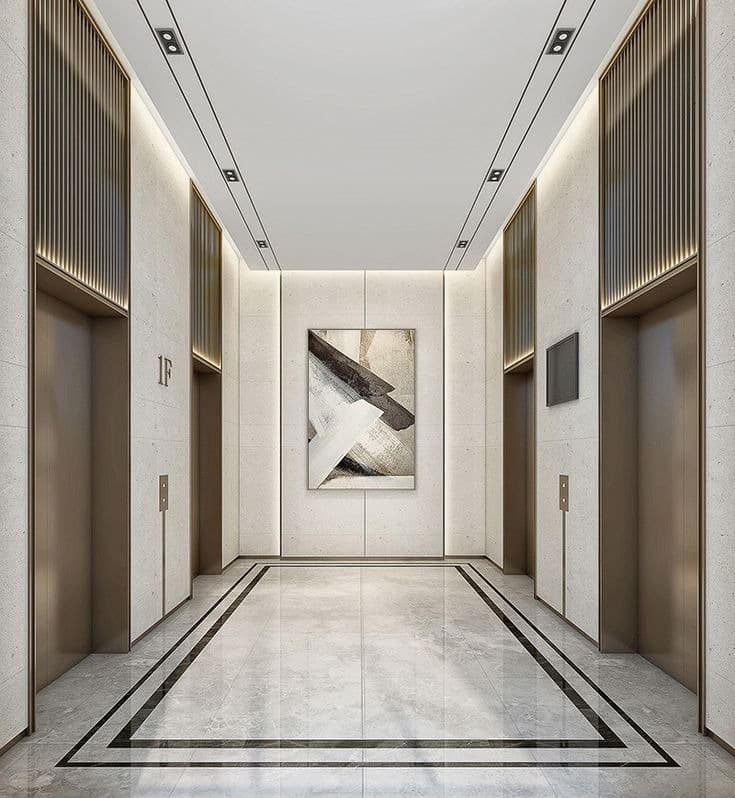 Elevator lobby with stone walls and bronze detailing